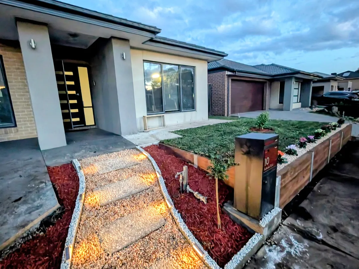 Stepping-stone path with garden lighting and border planting